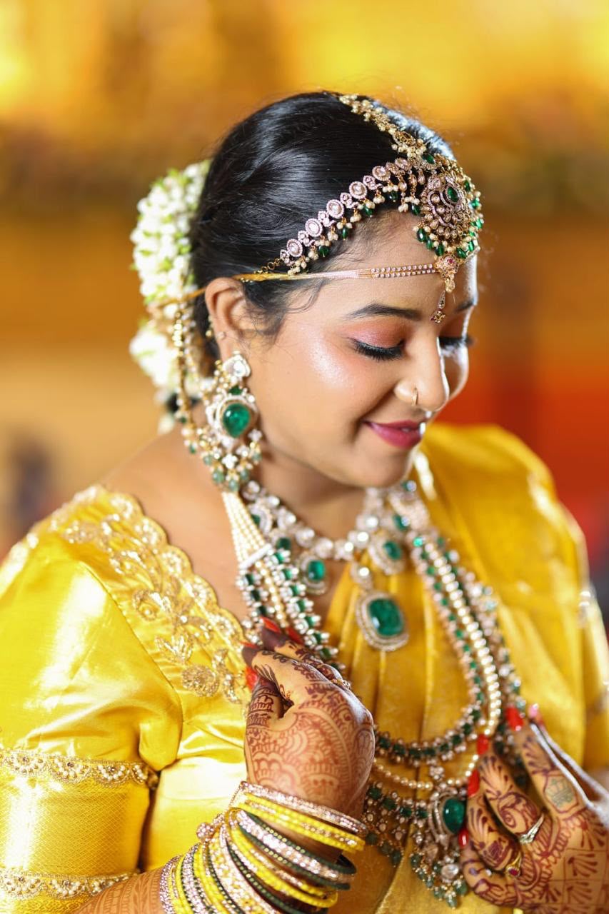 Close-up bridal makeup and jewellery detail